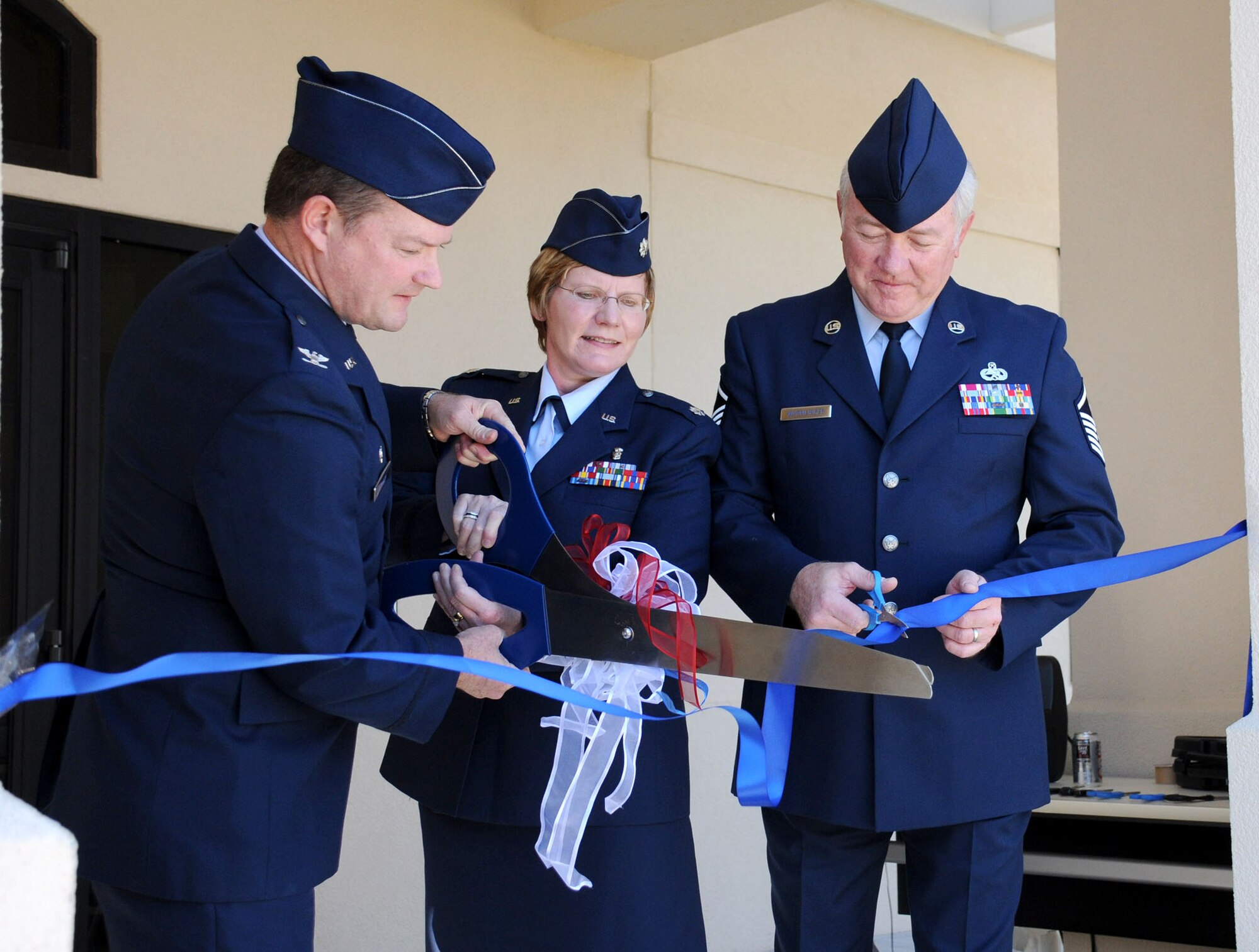 MacDill Air Force Base, Fla. -- Colonel David Pavey, commander of the 927th Air Refueling Wing, Lt. Col. Dawn Moore, commander of the Aerospace Staging Squadron, and Master Sgt. Gary Wurmlinger, first sergeant of the 927th Areomedical Staging Squadron officially opened the new ASTS building here.  The 18,000 square-foot complex will house ASTS and other tenant units, in addition to providing storage space, classrooms, and a medical learning lab.  (Official United States Air Force photo by Staff Sgt. Shawn C. Rhodes)