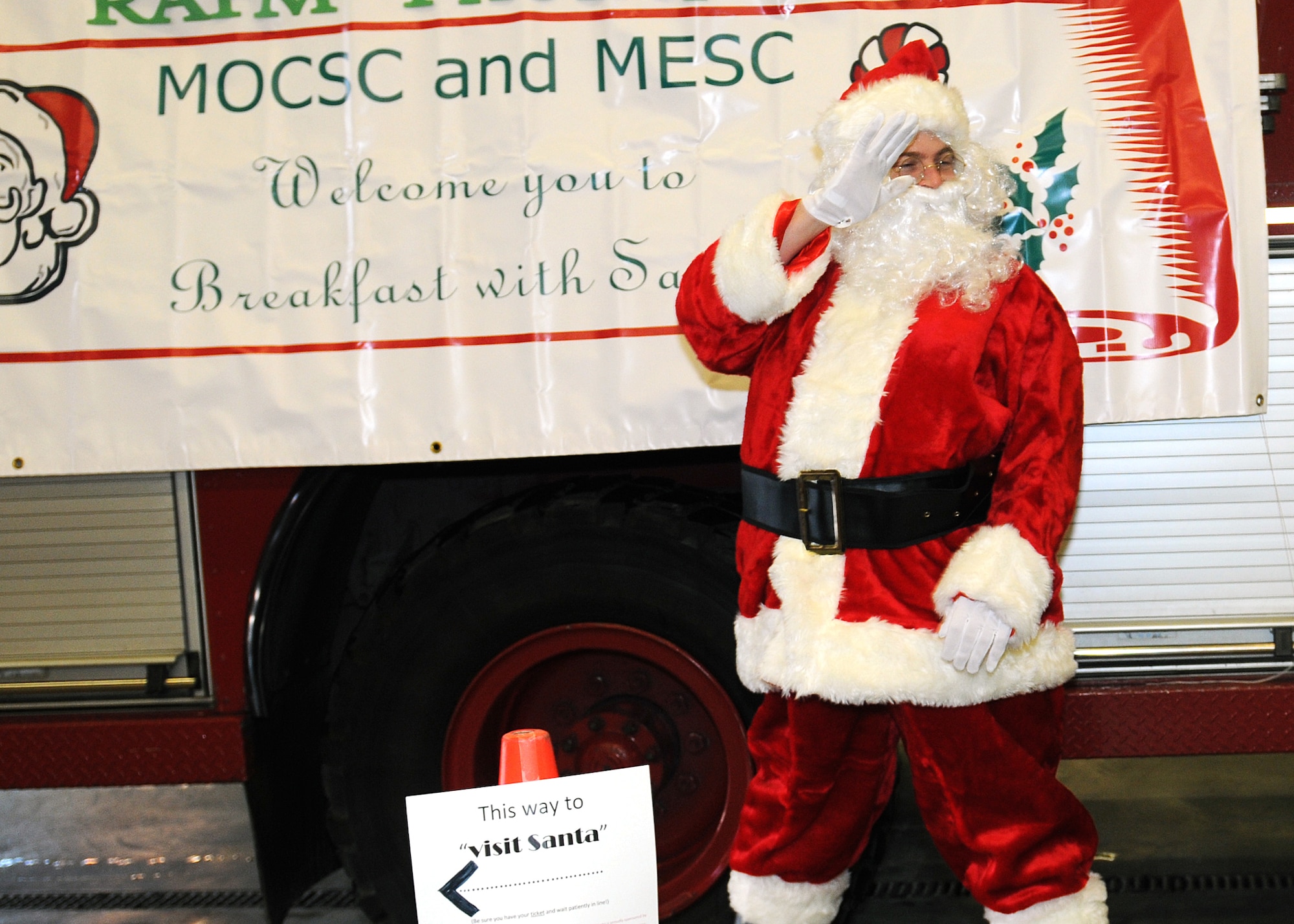 RAF MILDENHALL, England -- Santa arrives at the annual Breakfast with Santa Dec. 11, 2010, at the RAF Mildenhall Fire Department.  Santa took present requests from the children and gave them each a special gift.  (U.S. Air Force photo by/Karen Abeyasekere)