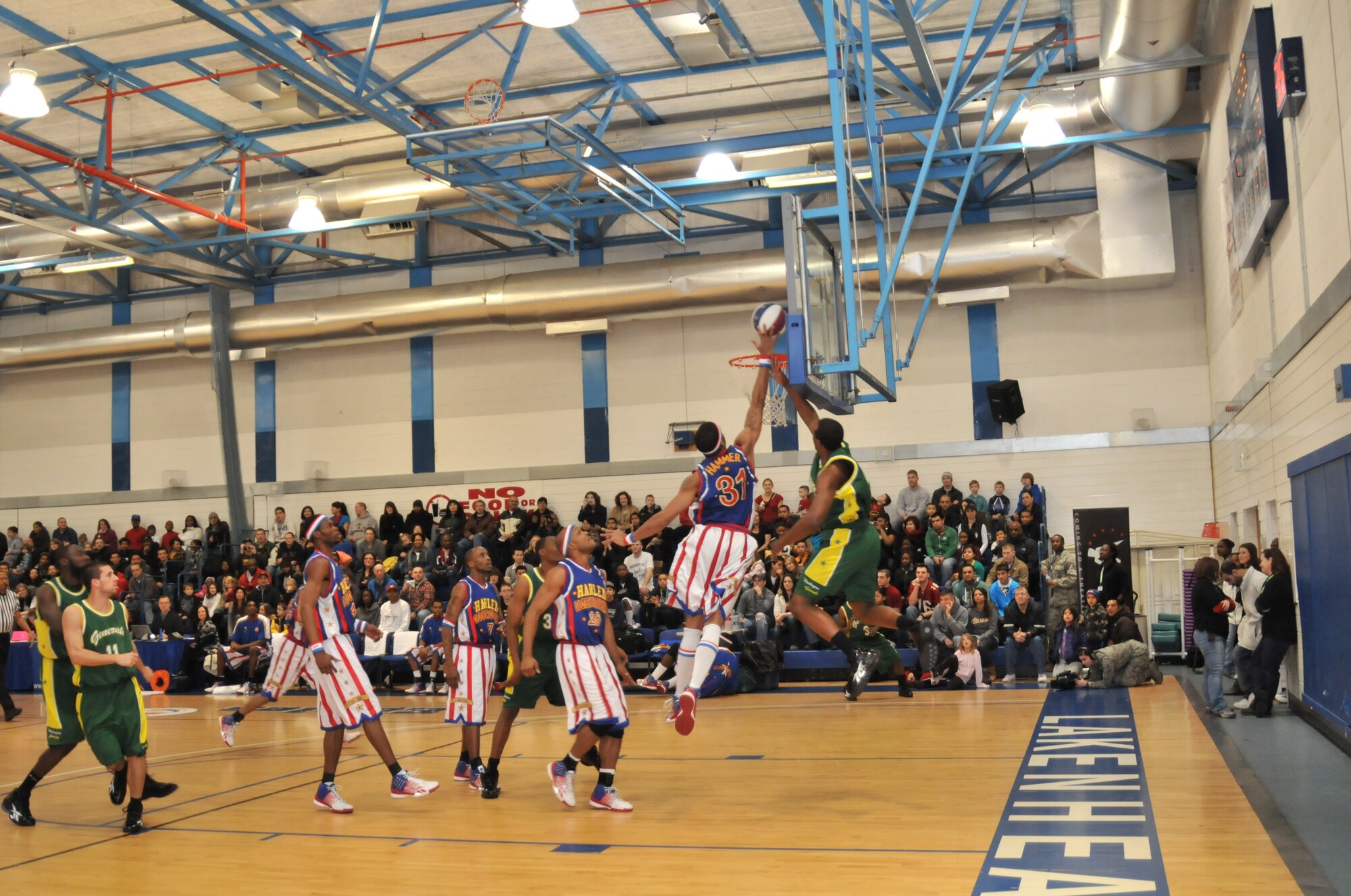 ROYAL AIR FORCE LAKENHEATH, England -- Harlem Globetrotter “Hammer” Harrison blocks a basket attempt during the Globetrotters game against the Washington Generals on Dec. 12 at the Sports & Fitness Center. The Globetrotters beat the Generals with a score of 101-71. (U.S. Air Force photo/Senior Airman David Dobrydney)