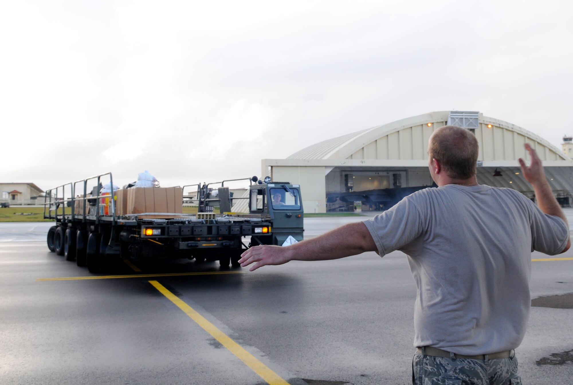 An Airman from the 36th Airlift Squadron, Yokota Air Base, Japan, loads boxes of humanitarian assistants goods onto a C-130 Hercules prior to take-off from Andersen Air Force Base, Guam, Dec. 14. This year more than 60 boxes will be dropped to 55 Island weighing in at more than 20,000 pounds. Operation Christmas Drop is the Air Force?s longest-running humanitarian which began in 1952. Airmen today continue the tradition delivering supplies to remote islands of the Commonwealth of the Northern Marianas Islands, Yap, Palau, Chuuk and Pohnpei. (U.S. Air Force photo/ Senior Airman Nichelle Anderson)   