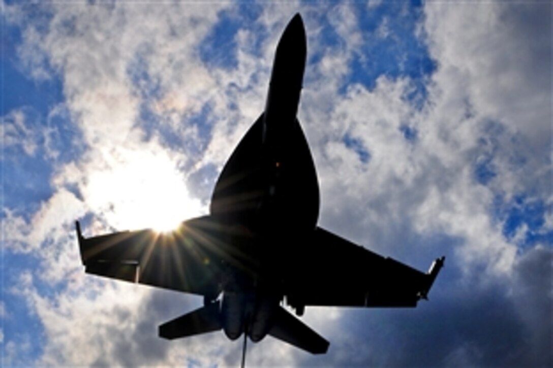 An F/A-18E Super Hornet approaches the aircraft carrier USS Enterprise for an arrested landing in the Atlantic Ocean, Dec. 9, 2010. The Enterprise Carrier Strike Group and embarked Carrier Air Wing 1 are participating in a joint exercise to prepare for an upcoming deployment.