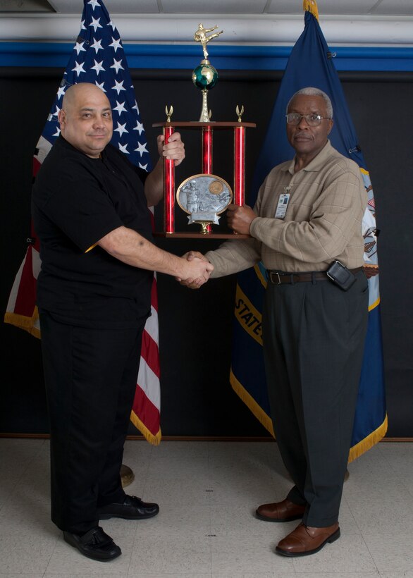 Raymond Applewhite (right) receives the Lester Ford Veterans Spirit Award for 2010 from Milt Nieves, retired master sergeant and presenter of the award, during a ceremony at the Naval Hospital, Dec. 14. The award recognizes an individual's continuing efforts to assist active-duty service members and retirees from all branches of the service in the Jacksonville, N.C. community.