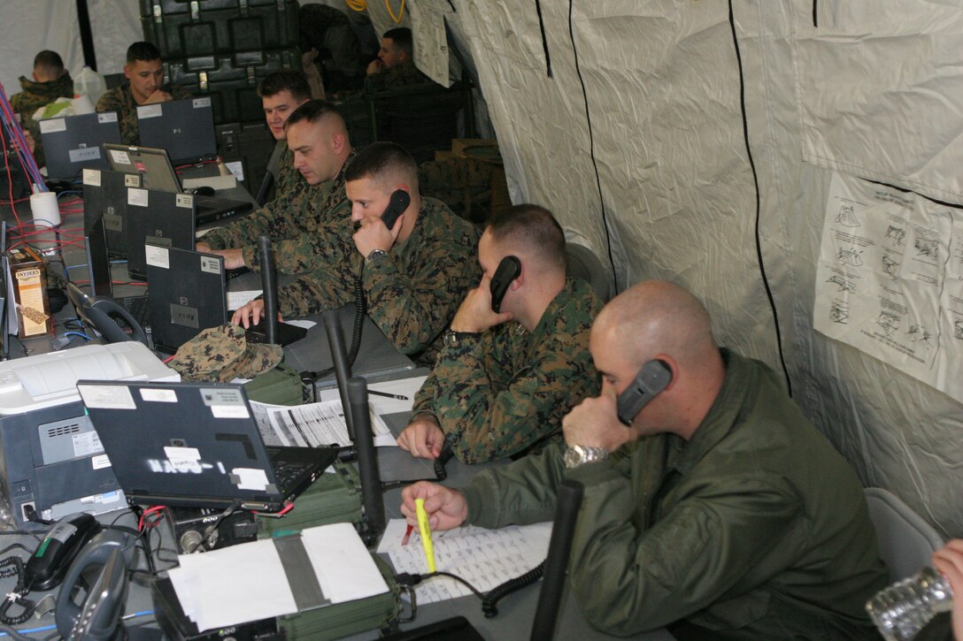 Marine Air Control Group 28 Marines communicate operational scenarios to their command and control sections during a Marine Air Command and Control System Integrated Simulated Training Exercise Dec. 15. The MISTEX was a three day field exercise conducted outside the MACG-28 headquarters building for the group to train before deploying to Afghanistan.