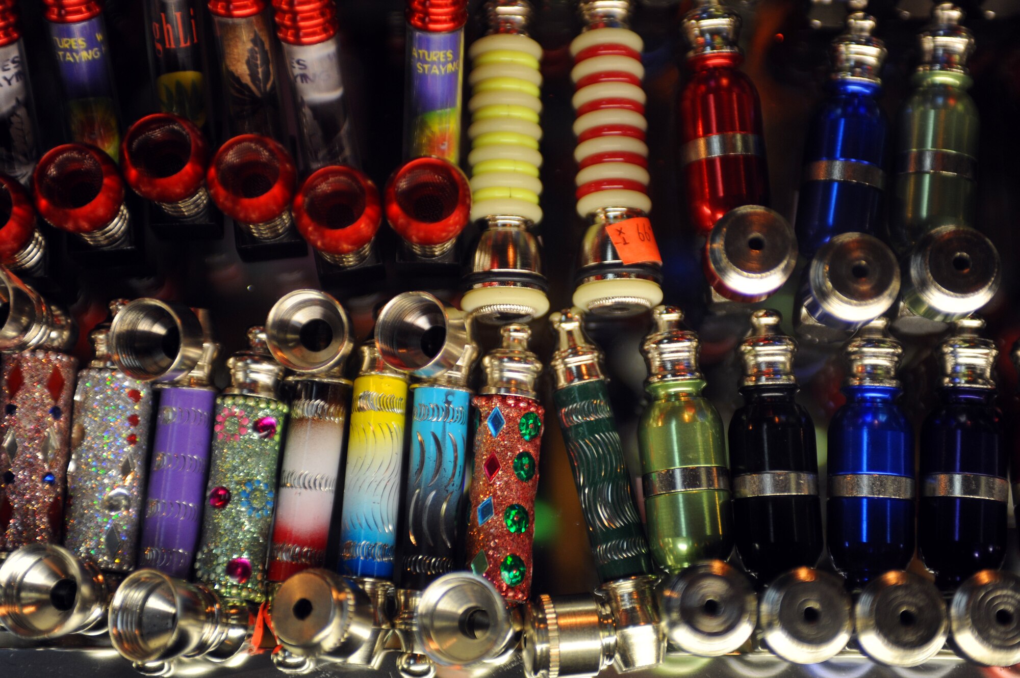 LAS VEGAS -- Pipes sit in a display case at a smoke shop near Nellis Air Force Base, Nev. These types of pipes are marketed to be used with legal tobacco products; however, they are also used for drugs such as marijuana and spice. Spice and other mood-altering substances are banned by the Air Force, but were legal to sell in the civilian community until Nov. 24, when the Drug Enforcement Administration used its emergency powers to ban spice and other products that mimic the effects of marijuana. (U.S. Air Force photo illustration by Tech. Sgt. Michael R. Holzworth)