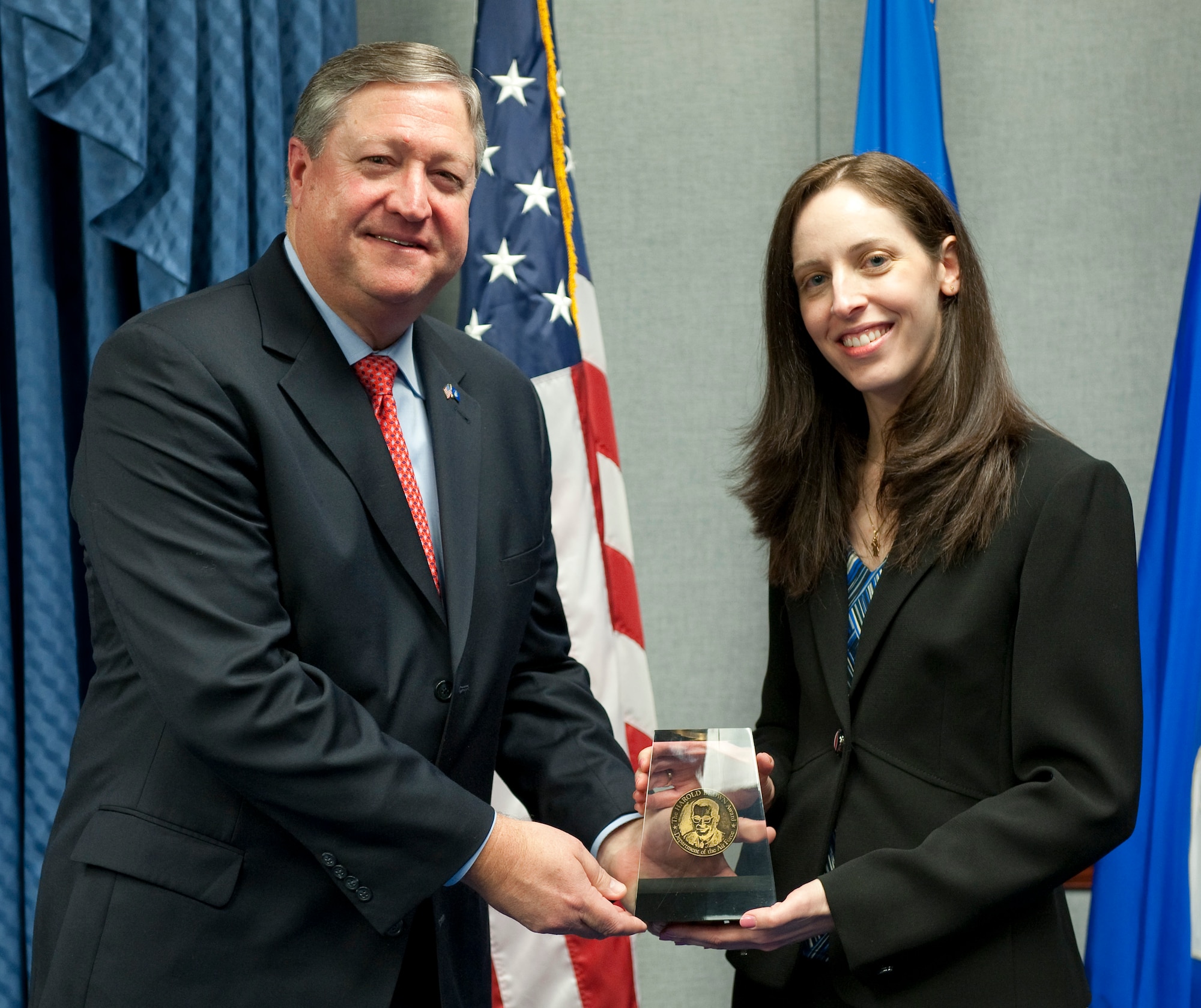 Secretary of the Air Force Michael Donley presents the 2010 Harold Brown Award to Dr. Candace Lynch during a ceremony in the Pentagon Dec. 15, 2010. The award was named for Harold Brown, a physicist who served as secretary of the Air Force from 1965 to1969. Dr. Lynch is the first female recipient of the award since its inception in 1969. (U.S. Air Force photo/Jim Varhegyi)