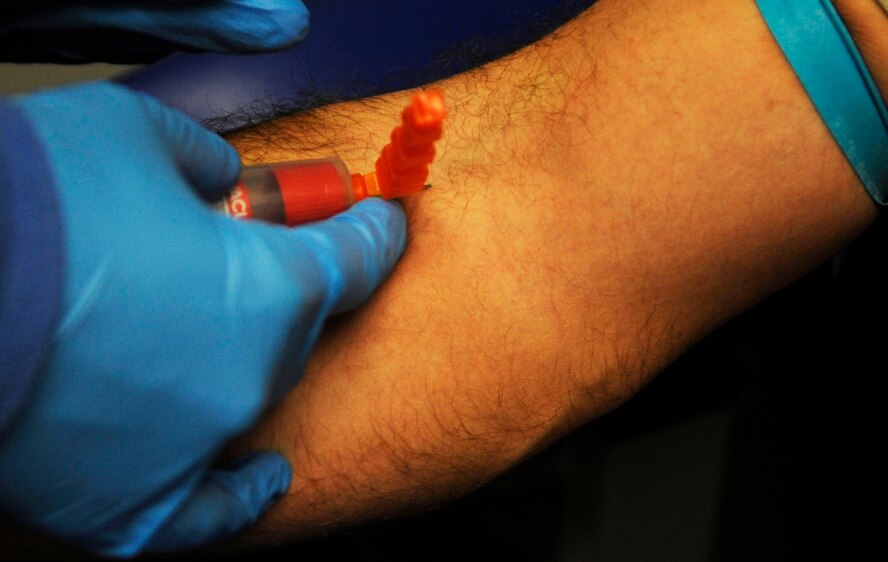 Senior Airman Marthinus Taljaard, 2nd Medical Group clinical laboratory technician, reads a patient's blood sample slide at the 2 MDG lab at Barksdale Air Force Base, La., Dec. 15. The slides are used to help diagnose infection. The 2 MDG laboratory was recently named the Air Force Global Strike Command laboratory team of the year. (U.S. Air Force photo /Staff Sgt. Terri Barriere)