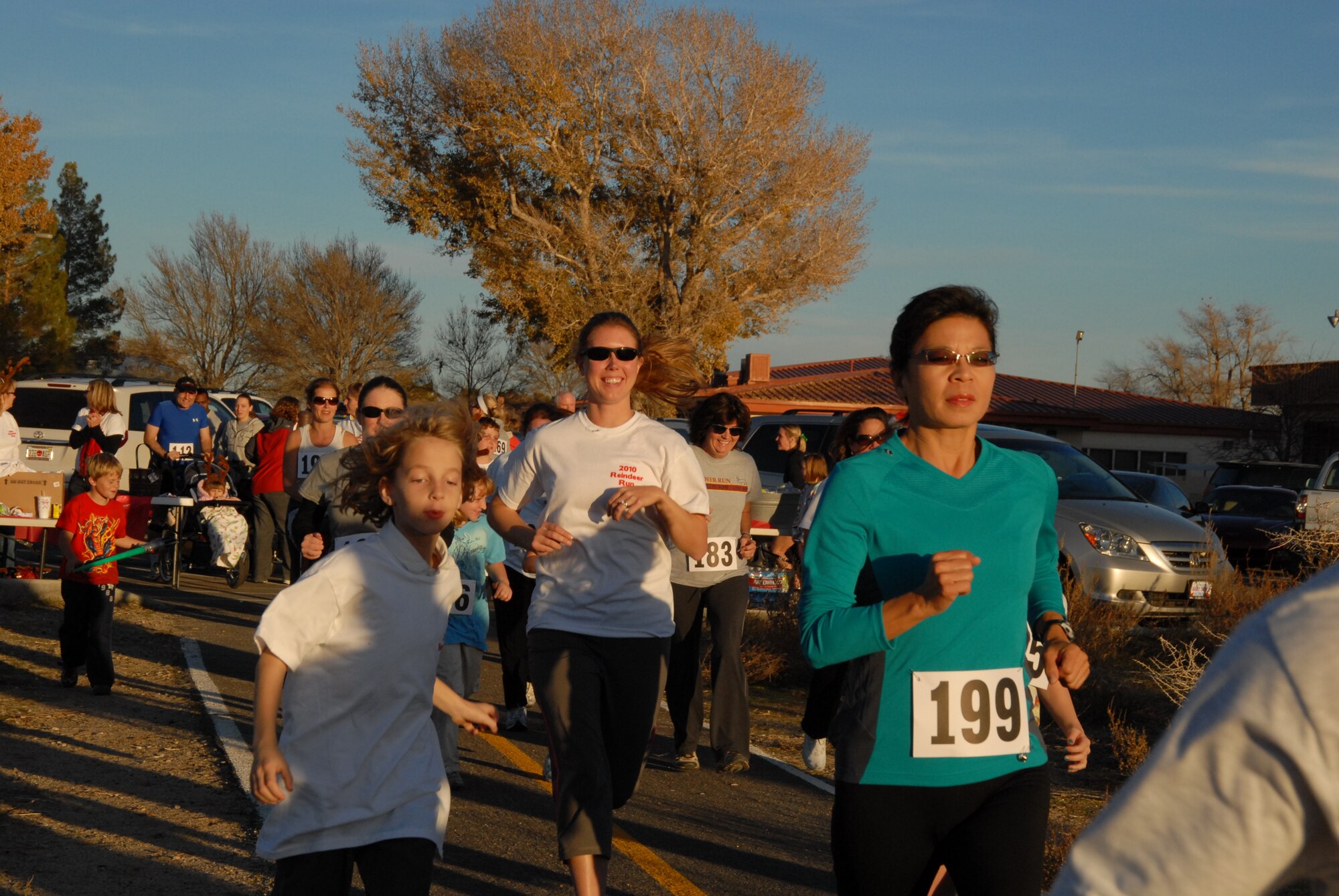 Participants take off from the Fitness and Sports Center parking lot during the annual Reindeer 5K Fun Run sponsored by the Edwards Officers’ Spouses’ Club, Dec. 8. (Air Force photo by Kate Blais)