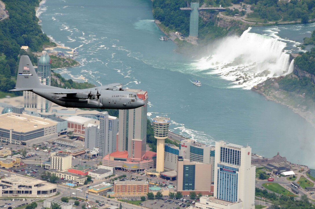 A 914th Airlift Wing C-130 aircraft flies over nearby wonder of the world, Niagara Falls, NY.(U.S. Air Force Photo by SSgt. Joseph McKee)