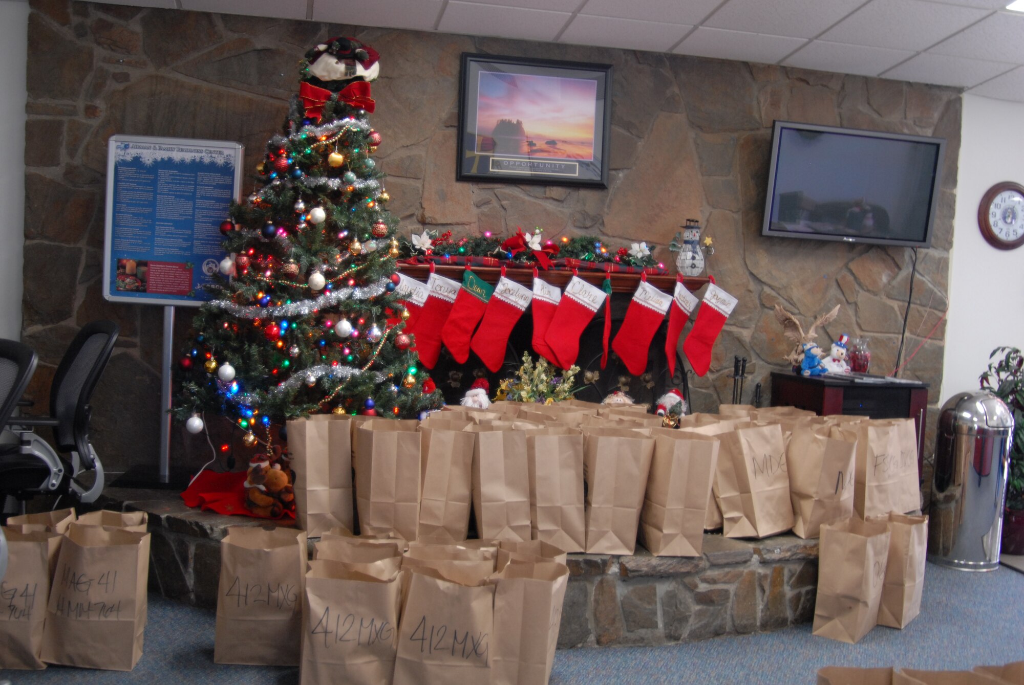Bags packed full of homemade holiday baked goods sit ready to be picked up by each first sergeant and delivered to dorm dwelling Airmen. The Airman and Family Readiness Center, along with the First Sergeants’ Association, sponsored the annual Dorm Dweller’s Cookie Drive, Dec. 8, to help spread holiday cheer to Airmen who live in the dorms. (Air Force photo by Kate Blais)