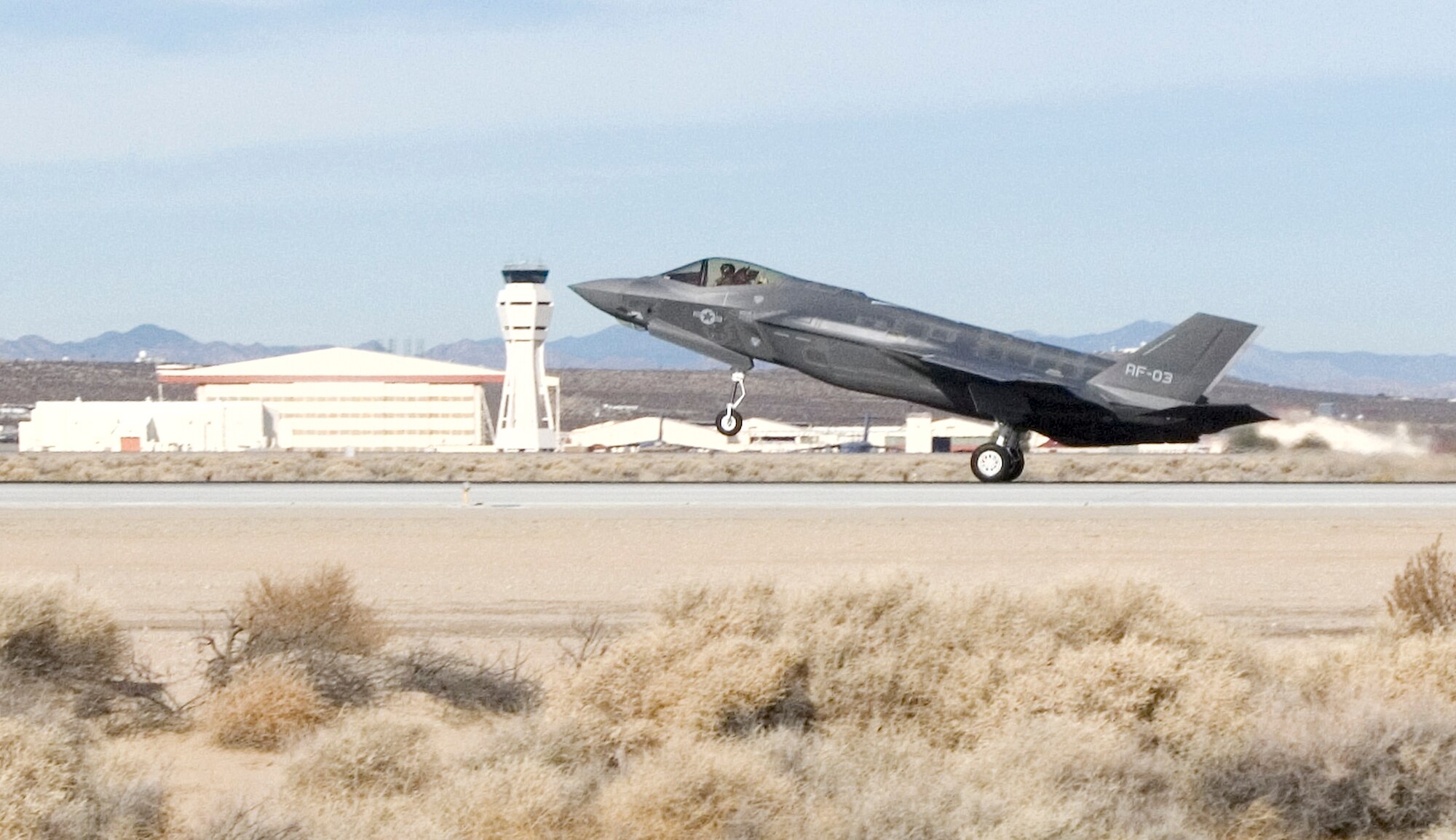 AF-03, the newest Joint Strike Fighter to land at Edwards, arrived from Fort Worth, Texas, for test and evaluation, Dec. 11. Equipped with avionics and sensors, the new F-35 Lighting II is the first mission-systems aircraft of the fleet. It joins AF-01 and AF-02, which arrived at Edwards in May. Test flights of AF-03 commenced, Dec. 13. (Air Force photo by Edward Cannon)