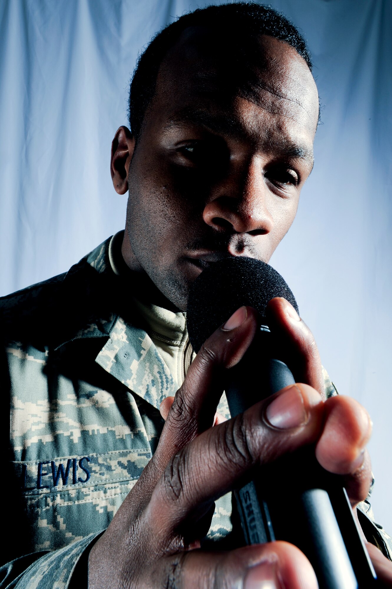 JOINT BASE ELMENDORF-RICHARDSON, Alaska -- Airman 1st Class Kerry Lewis, 3rd Maintenance Operation Squadron, recites his poem "Jus' Listen" during a photoshoot here, Dec. 14.(U.S. Air Force Photo/ Staff Sgt. Joshua Garcia)
