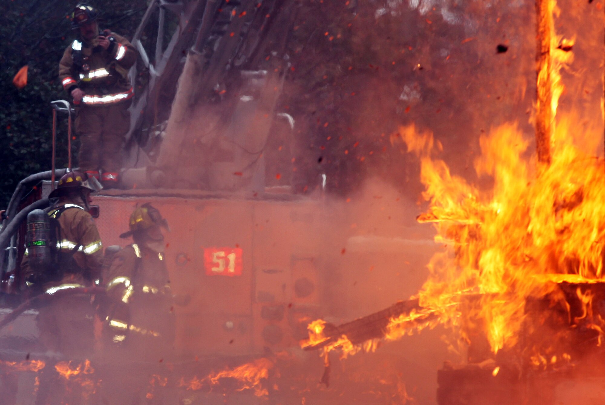 Fire Crews from both the Dobbins Fire and Emergency Services and Marietta Fire Department team up to perform live fire training scenario. (U.S. Air Force Photo/Don Peek) 