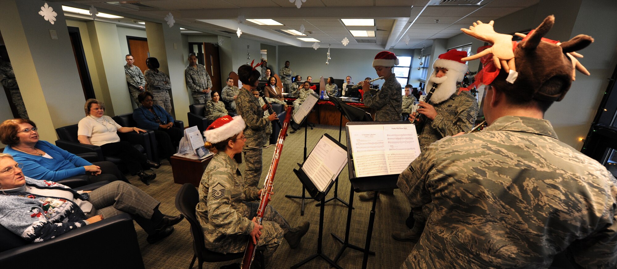 The Langley Air Force Base Woodwind Quintet plays Christmas music to help
raise morale during the holiday season at wing finance Dec. 14, 2010 on
Joint Base Charleston, S.C. The quintet visited both Naval and Air Force
sides of Joint Base Charleston performing 15 minute mini-concerts and sing
along sessions. The Langley Woodwind Quintet also performed for the Naval
Health Clinic, SPAWAR and the 437th Maintenance Group. (U.S. Air Force
photo/Senior Airman Timothy Taylor)