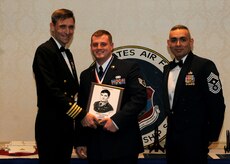 Staff Sgt. Nicholas Albanese is awarded the John Levitow award by Capt.
Ralph Ward (left) and Chief Master Sgt.Jose LugoSantiago at the Airman
Leadership School graduation Dec. 9, 2010 on Joint Base Charleston, S.C. The
Levitow award is the highest award presented to the Airman that displays the
best overall performance evaluation, peer to staff rating and academic
ranking. ALS is a six week course designed to develop Airmen into effective
leaders and supervisors. Sergeant Albanese is an installation patrolman with
the 628th Security Forces Squadron. Captain Ward is the Deputy Commander,
628th Air Base Wing and Chief LugoSantiago is the Command Chief for the
628th Air Base Wing. (U.S. Air Force photo/Senior Airman Timothy Taylor)