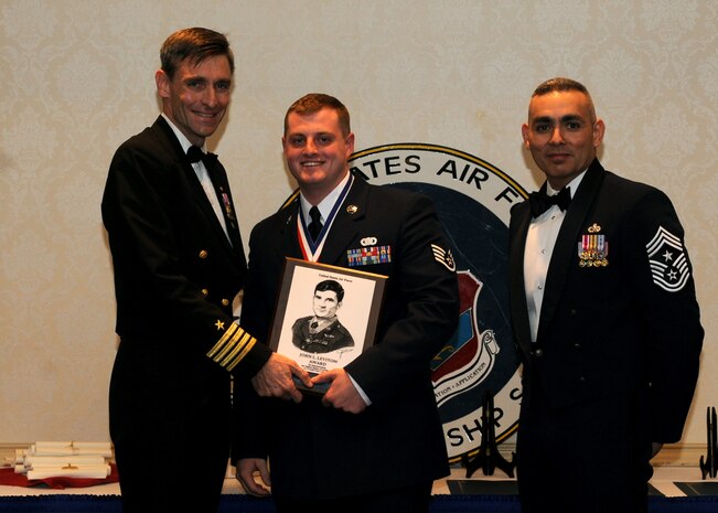 Staff Sgt. Nicholas Albanese is awarded the John Levitow award by Capt.
Ralph Ward (left) and Chief Master Sgt.Jose LugoSantiago at the Airman
Leadership School graduation Dec. 9, 2010 on Joint Base Charleston, S.C. The
Levitow award is the highest award presented to the Airman that displays the
best overall performance evaluation, peer to staff rating and academic
ranking. ALS is a six week course designed to develop Airmen into effective
leaders and supervisors. Sergeant Albanese is an installation patrolman with
the 628th Security Forces Squadron. Captain Ward is the Deputy Commander,
628th Air Base Wing and Chief LugoSantiago is the Command Chief for the
628th Air Base Wing. (U.S. Air Force photo/Senior Airman Timothy Taylor)