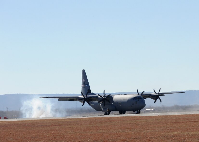 DYESS AIR FORCE BASE, Texas -- A C-130J lands here Dec. 8. The aircraft is the fourth of 28 new aircraft to be delivered by 2013, replacing the current aging fleet of C-130H models. The new aircraft brings many improvements over the C-130H model including avionics and an enhanced cargo handling system. (U.S. Air Force Photo/Senior Airman Jenifer H. Calhoun)