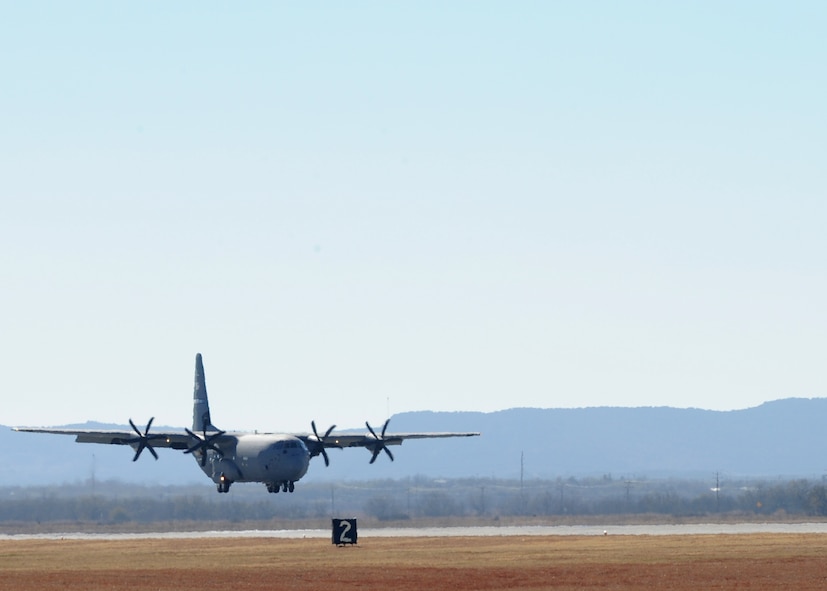 DYESS AIR FORCE BASE, Texas -- A C-130J lands here Dec. 8. The aircraft is the fourth of 28 new aircraft to be delivered by 2013, replacing the current aging fleet of C-130H models. The new aircraft brings many improvements over the C-130H model including avionics and an enhanced cargo handling system. (U.S. Air Force Photo/Senior Airman Jenifer H. Calhoun)