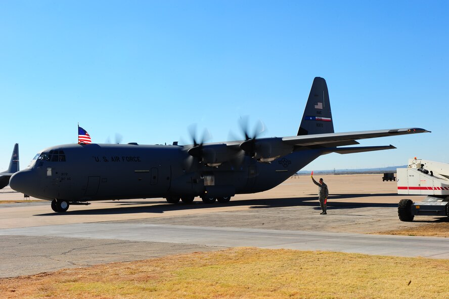 DYESS AIR FORCE BASE, Texas -- Lt. Gen. Vern M. Findley II, Air Mobility Command vice commander, taxis a C-130J here Dec. 8. The aircraft is the fourth of 28 new aircraft to be delivered by 2013, replacing the current aging fleet of C-130H models. The new aircraft brings many improvements over the C-130H model including avionics and an enhanced cargo handling system. (U.S. Air Force Photo/Airman 1st Class Chelsea Cummings)
