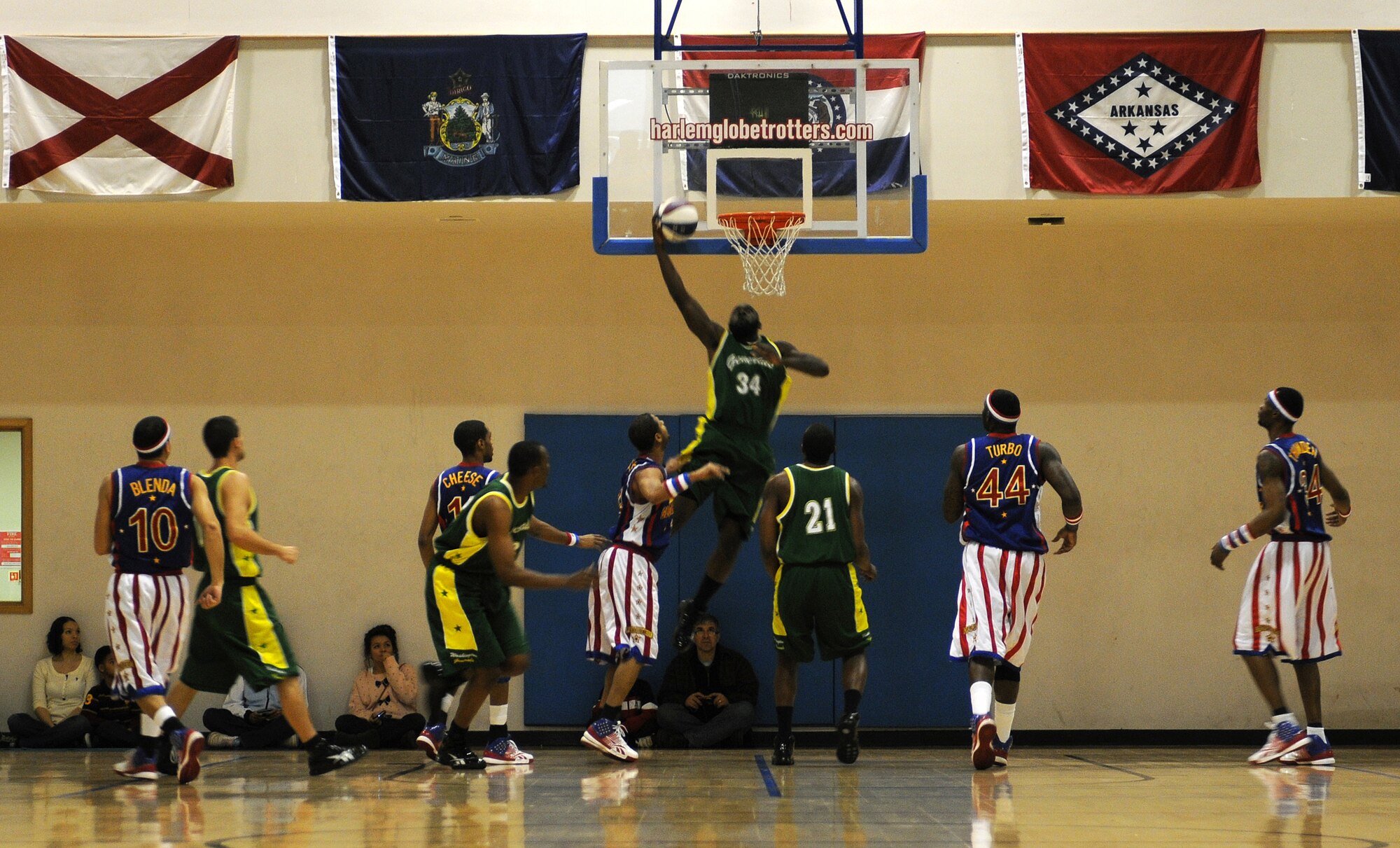 RAF MILDENHALL, England -- The Harlem Globetrotters play defense against the Generals, an expeditionary team that travels with the Globetrotters, here Dec. 11, 2010.  The Globetrotters have been performing for audiences for 84 years. (U.S. Air Force photo/Senior Airman Tabitha M. Lee)