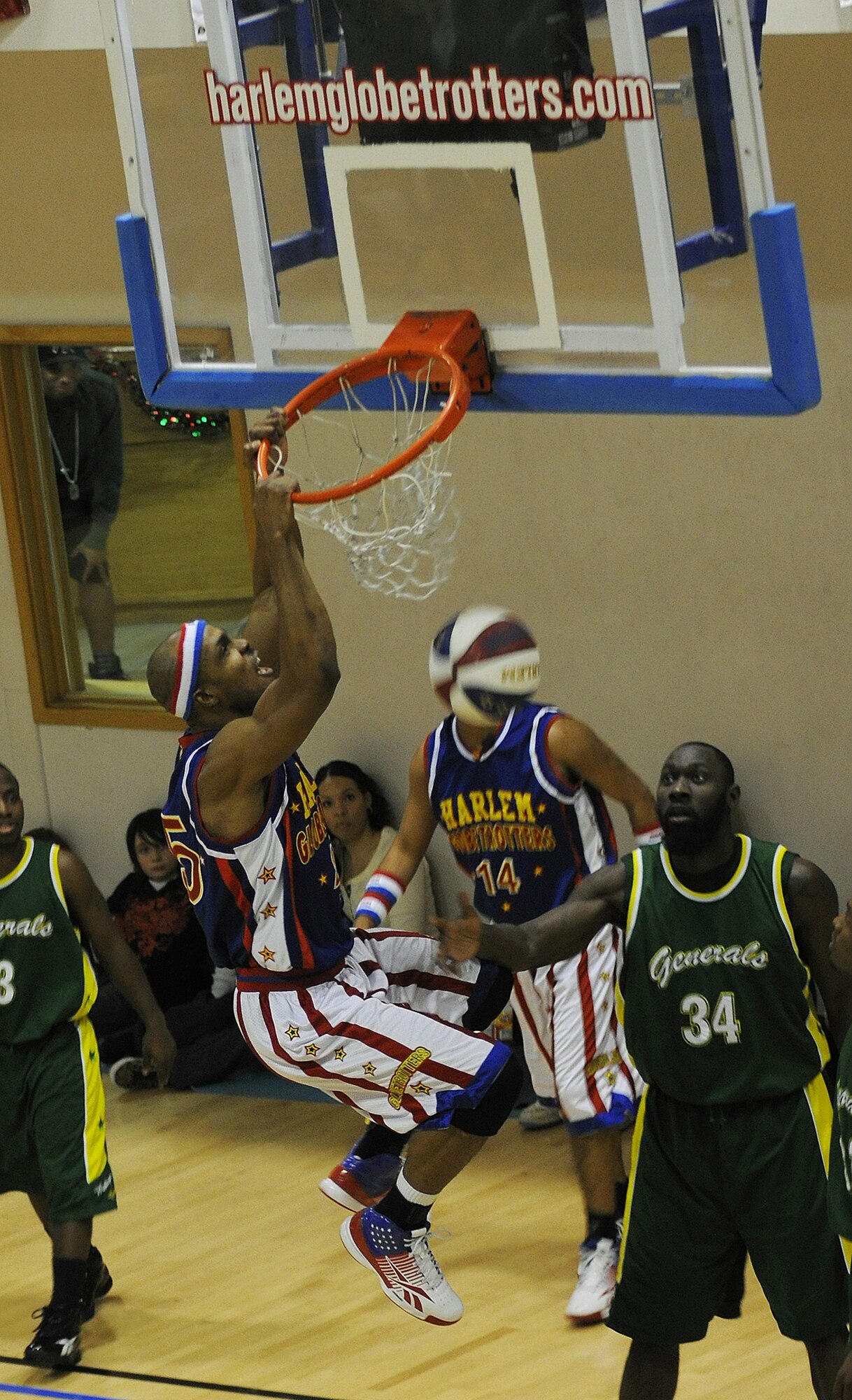 RAF MILDENHALL, England -- Zeus Stewart dunks the ball during a game here Dec. 11, 2010.  The Harlem Globetrotters performed at the Hardstand Fitness Center for more than 750 servicemembers and their families. (U.S. Air Force photo/Senior Airman Tabitha M. Lee) 