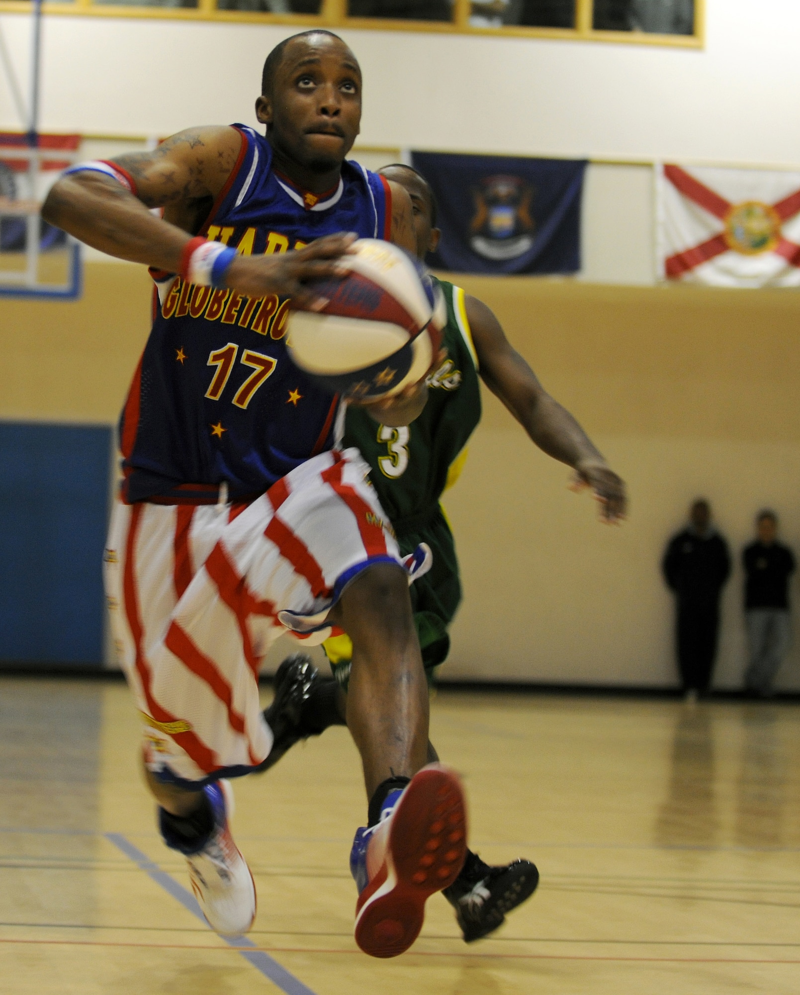 RAF MILDENHALL, England -- Rocket Rivers goes for a layup here Dec. 11, 2010.  More than 750 servicemembers and their families came out to watch the Harlem Globetrotters perform. (U.S. Air Force photo/Senior Airman Tabitha M. Lee)   