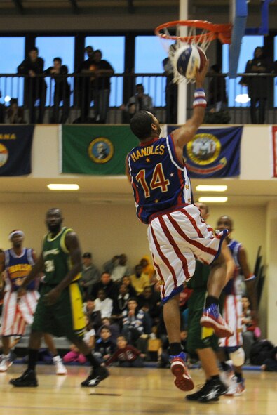 RAF MILDENHALL, England -- Handles Franklin goes for a layup here Dec. 11, 2010.  The Harlem Globetrotters' performance combines athleticism, theater and comedy for family-friendly entertainment. (U.S. Air Force photo/Senior Airman Tabitha M. Lee)