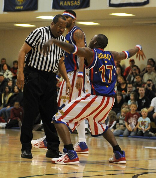 RAF MILDENHALL, England -- Rocket Rivers flaps his arms at the referee as part of the Harlem Globetrotter's performance here Dec. 11, 2010.  Globetrotters, who were charged with acts of tomfoolery during the game, were sent to the penalty chair for 10 seconds. (U.S. Air Force photo/Senior Airman Tabitha M. Lee)   