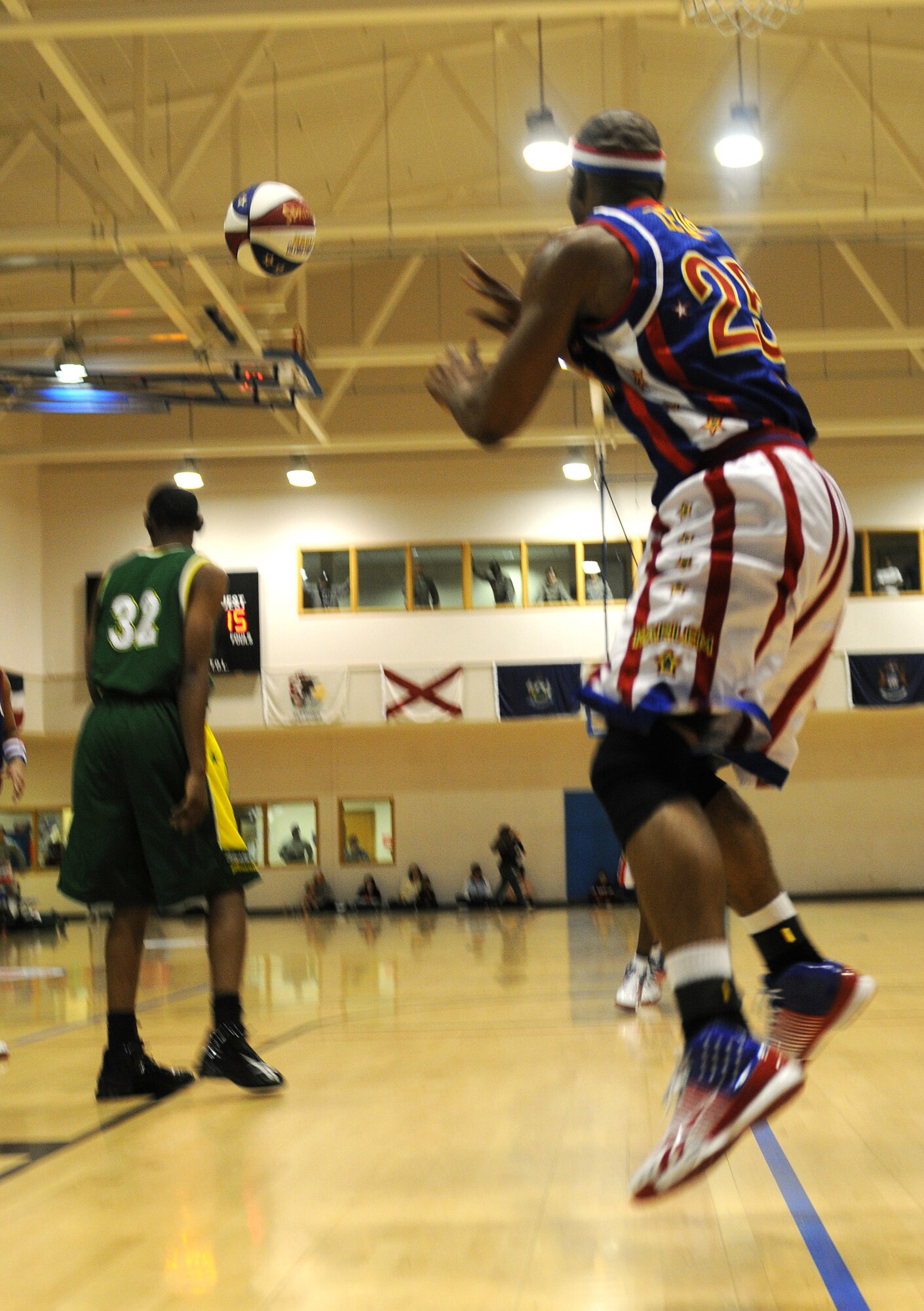 RAF MILDENHALL, England -- Zeus Stewart receives a pass during a game here Dec. 11, 2010.  More than 750 servicemembers and their families came out to the Hardstand Fitness Center to see the Harlem Globetrotters. (U.S. Air Force photo/Senior Airman Tabitha M. Lee)   