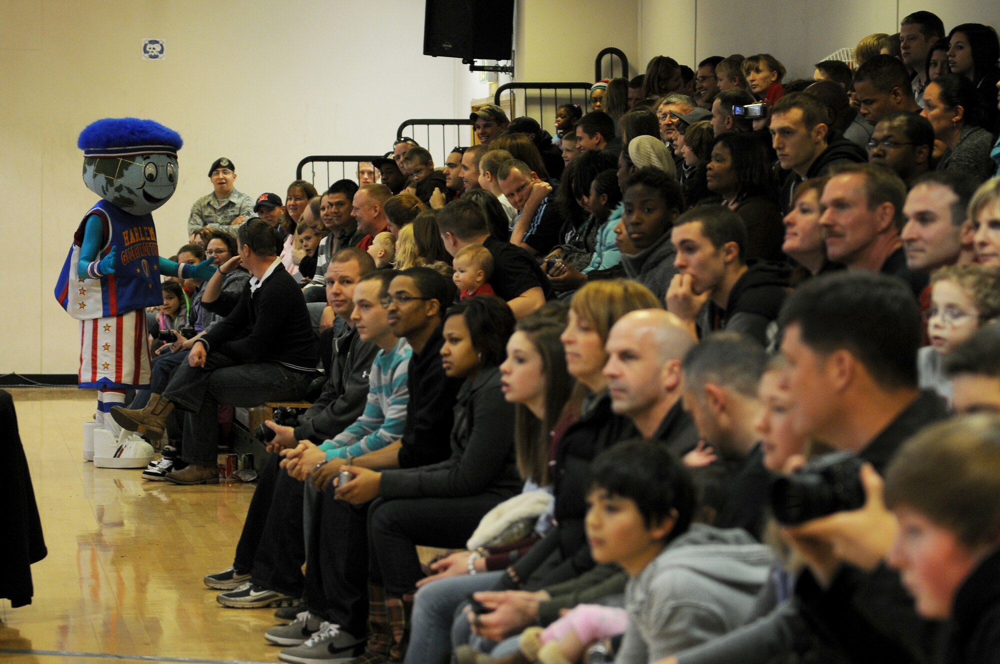 RAF MILDENHALL, England -- Globie, the Harlem Globetrotters' mascot, gets to know the crowd before a show here Dec. 11, 2010.  The Globetrotters performed for more than 750 servicemembers and their families at the Hardstand Fitness Center. (U.S. Air Force photo/Senior Airman Tabitha M. Lee)