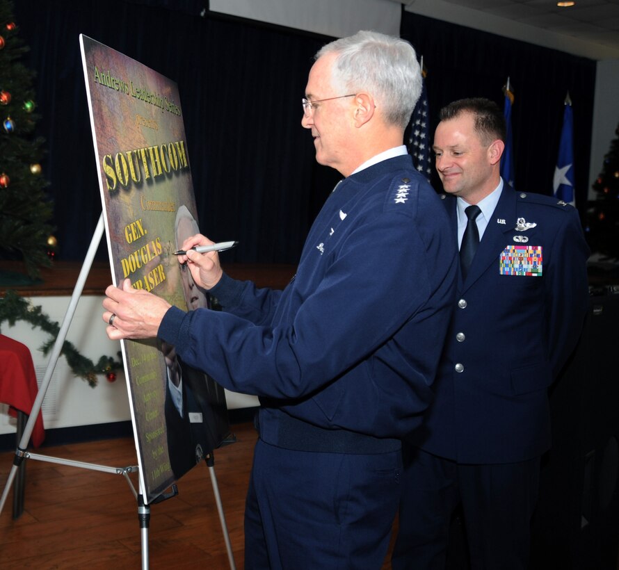 General Douglas Fraser, Southern Command commander, signs a poster for
the 11th Wing at the Joint Base Andrews at the community activities center
Dec. 14, 2010. General
Fraser spoke as part of the 11th Wing Leadership series, which invites guest
leaders to come and speak.  General Fraser took command of Southern Command
in June of 2009 after serving as the deputy commander of U.S. Pacific
Command. (U.S. Air Force photo by Senior Airman Melissa V. Brownstein) 

