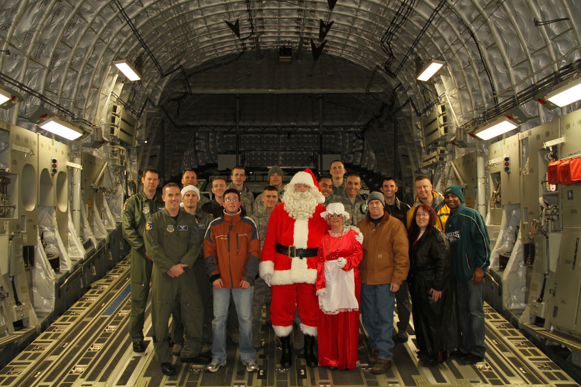 Members from the "Santa on a C-17" photo event come together for a group photo Dec. 5, 2010. The event was sponsored by the Dover AFB Airman & Family Readiness Center for its second year. (U.S. Air Force Courtesy photo/Released)