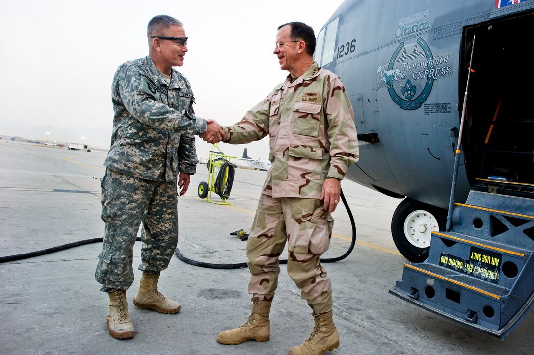 U.S. Army Lt. Gen. John F. Campbell, left, welcomes U.S. Navy Adm. Mike Mullen, right, chairman of the Joint Chiefs of Staff, to Bagram Airfield, Afghanistan, Dec.15, 2010.  Mullen and his wife, Deborah, are hosting the USO holiday tour featuring comedians Robin Williams, Lewis Black and Kathleen Madigan, Tour de France champion Lance Armstrong and country musicians Kix Brooks and Bob Dipiero in the Central Command area of responsibility. Campbell is the commanding general, Combined Joint Task Force 101.