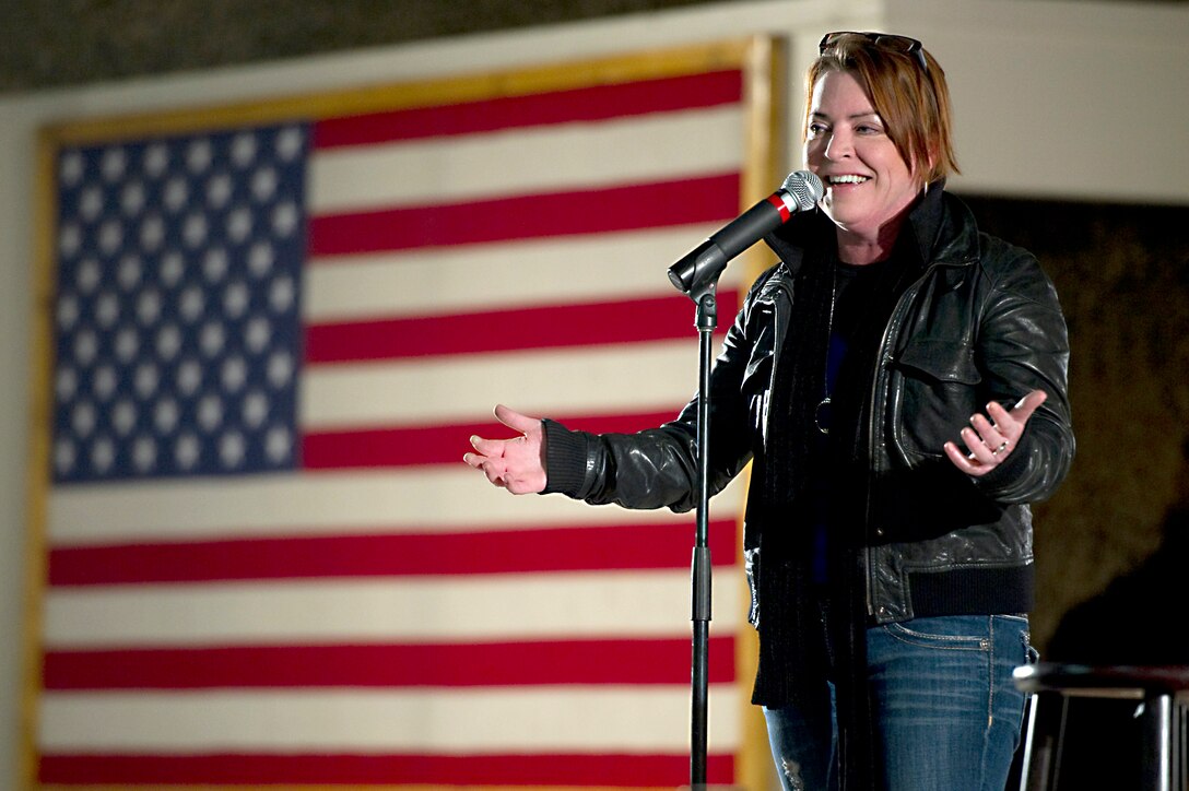 Comedian Kathleen Madigan performs at the USO holiday tour on Bagram Airfield, Afghanistan, Dec.15, 2010.