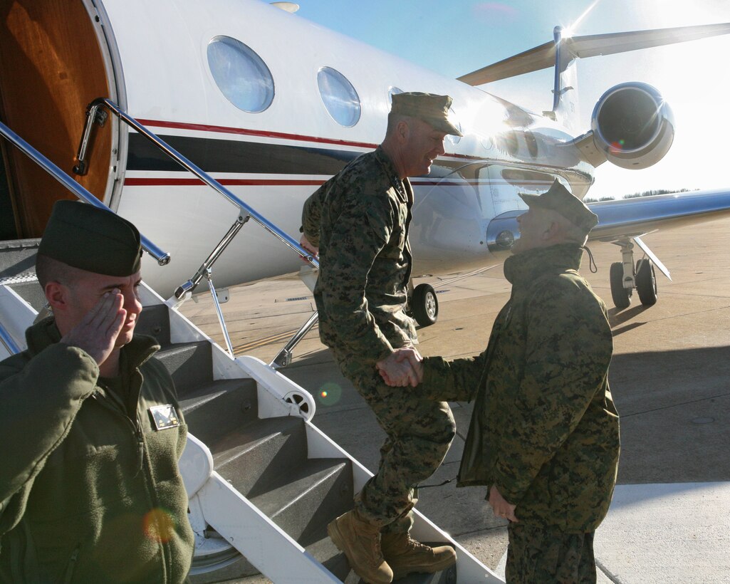 Lt. Col. Nelson Cardella, the commanding officer of the Black Sea Rotational Force 2011, shakes hands with Georgian Army Col. Zurab Tomauri, co-director of the Agile Spirit 2011 exercise, inside the Reserve Support Unit building Dec. 15. Cardella and Tomauri met to discuss upcoming training in the Black Sea Region.