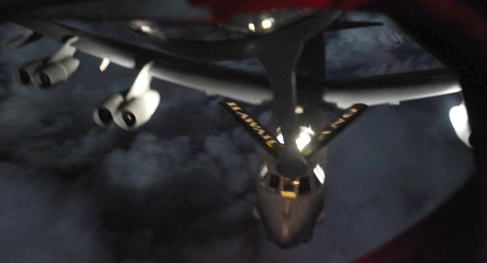 A B-52 Stratofortress is refueled by a KC-135 Stratotanker manned by members of the 96th and 203rd Air Refueling Squadrons over the Pacific Ocean Dec. 15 as part of the second sortie of the 96th ARS's first operational mission. During the mission, a 96th ARS KC-135 joined a KC-135 from the Iowa Air National Guard as part of a two-ship formation to refuel two B-52 Stratofortresses on the way to Guam. The KC-135s off loaded 105 thousand pounds of fuel to each of the B-52s. (U.S. Air Force photo/Airman 1st Class Lauren Main)