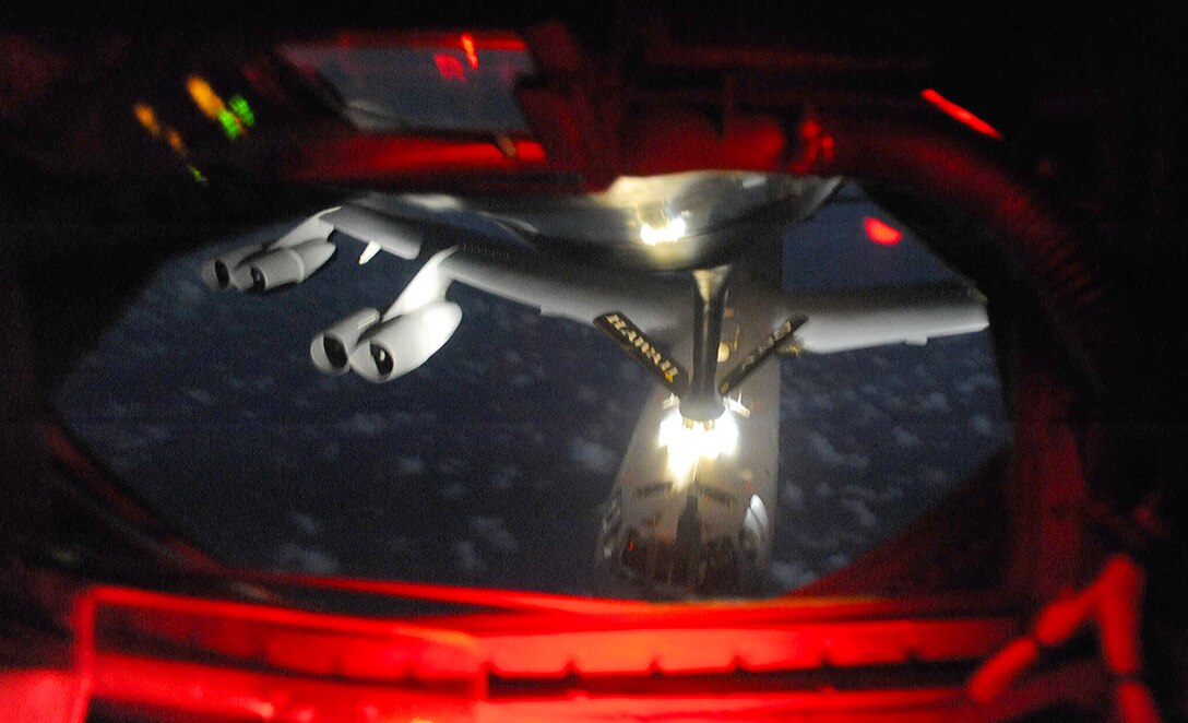 A B-52 Stratofortress is refueled by a KC-135 Stratotanker manned by members of the 96th and 203rd Air Refueling Squadrons over the Pacific Ocean Dec. 15 as part of the second sortie of the 96th ARS's first operational mission. During the mission, a 96th ARS KC-135 joined a KC-135 from the Iowa Air National Guard as part of a two-ship formation to refuel two B-52 Stratofortresses on the way to Guam. The KC-135s off loaded 105,000 pounds of fuel to each of the B-52s. (U.S. Air Force photo/Airman 1st Class Lauren Main)