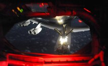 A B-52 Stratofortress is refueled by a KC-135 Stratotanker manned by members of the 96th and 203rd Air Refueling Squadrons over the Pacific Ocean Dec. 15 as part of the second sortie of the 96th ARS's first operational mission. During the mission, a 96th ARS KC-135 joined a KC-135 from the Iowa Air National Guard as part of a two-ship formation to refuel two B-52 Stratofortresses on the way to Guam. The KC-135s off loaded 105,000 pounds of fuel to each of the B-52s. (U.S. Air Force photo/Airman 1st Class Lauren Main)