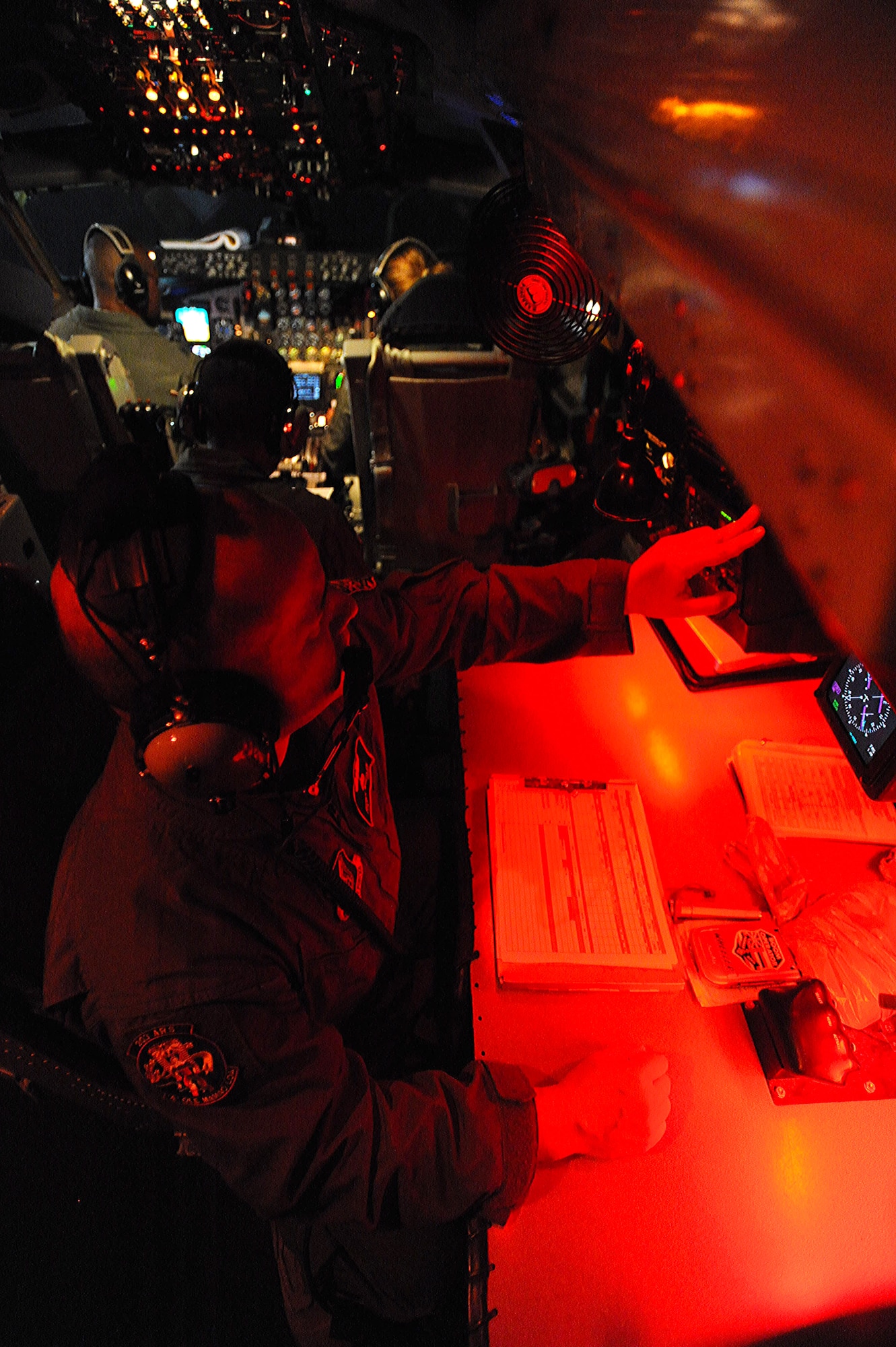 A combined crew from the 96th Air Refueling Squadron and Hawaii Air National Guard review the pre-flight inspection checklist prior to take off for the second sortie of the squadron's first operational refueling mission, Dec. 15 at Joint Base Pearl Harbor-Hickam, Hawaii. During the mission, a 96th ARS KC-135 Stratotanker joined a KC-135 from the Iowa Air National Guard as part of a two-ship formation to refuel two B-52 Stratofortresses on the way to Guam. (U.S. Air Force photo/Airman 1st Class Lauren Main)