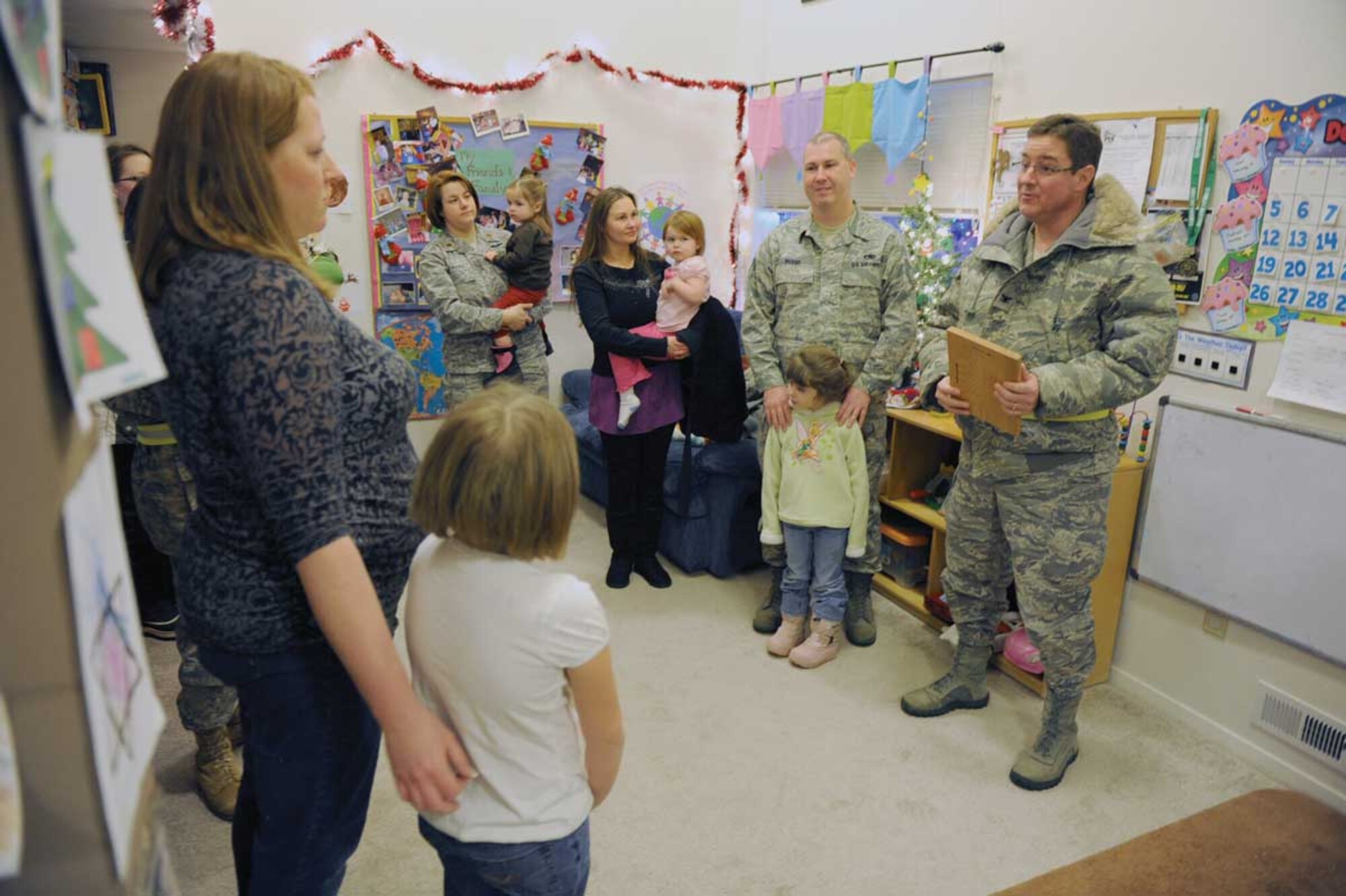 Air Force Col. Robert Evans, JBER/673d ABW commander, presents Tabitha Meyers with the Provider of the Year award. (Courtesy photo)