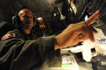 Tech. Sgt. Derek Wheeler, a boom operator with the Hawaii Air National Guard, prepares for the second sortie of the 96th Air Refueling Squadron's first operational refueling mission, Dec. 15 at Joint Base Pearl Harbor-Hickam, Hawaii. During the mission, a 96th ARS KC-135 Stratotanker joined a KC-135 from the Iowa Air National Guard as part of a two-ship formation to refuel two B-52 Stratofortresses on the way to Guam. (U.S. Air Force photo/Airman 1st Class Lauren Main)