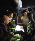Lt. Col. Eric Brumskilll, 96th Air Refueling Squadron, KC-135 pilot goes over mission safety for the second sortie of the squadron's first operational refueling mission, Dec. 15 at Joint Base Pearl Harbor-Hickam, Hawaii. During the mission, a 96th ARS KC-135 Stratotanker joined a KC-135 from the Iowa Air National Guard as part of a two-ship formation to refuel two B-52 Stratofortresses on the way to Guam. (U.S. Air Force photo/Airman 1st Class Lauren Main)