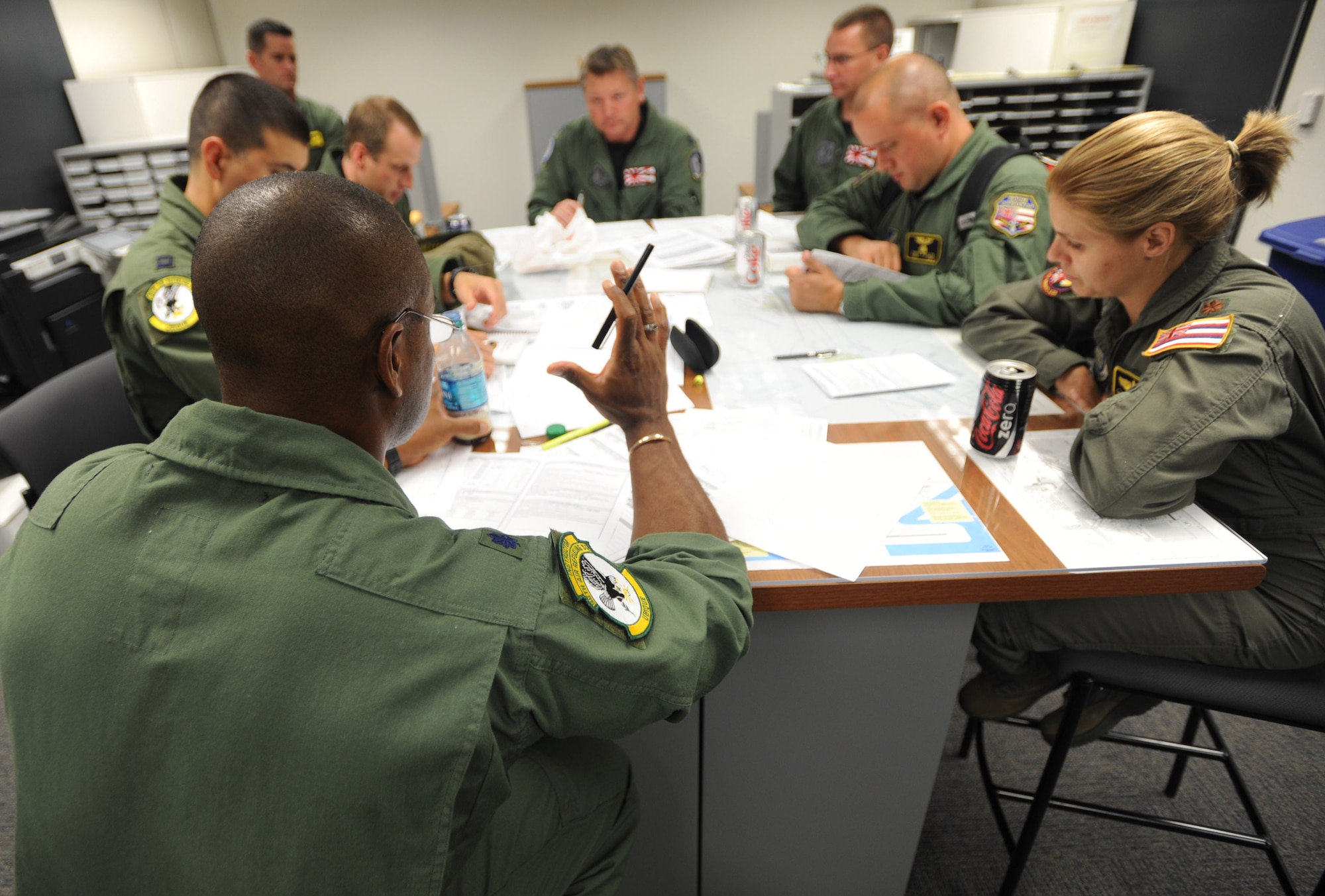 Lt. Col. Eric Brumskilll, 96th Air Refueling Squadron, KC-135 pilot goes over mission safety for the second sortie of the squadron's first operational refueling mission, Dec. 15 at Joint Base Pearl Harbor-Hickam, Hawaii. During the mission, a 96th ARS KC-135 Stratotanker joined a KC-135 from the Iowa Air National Guard as part of a two-ship formation to refuel two B-52 Stratofortresses on the way to Guam. (U.S. Air Force photo/Airman 1st Class Lauren Main)