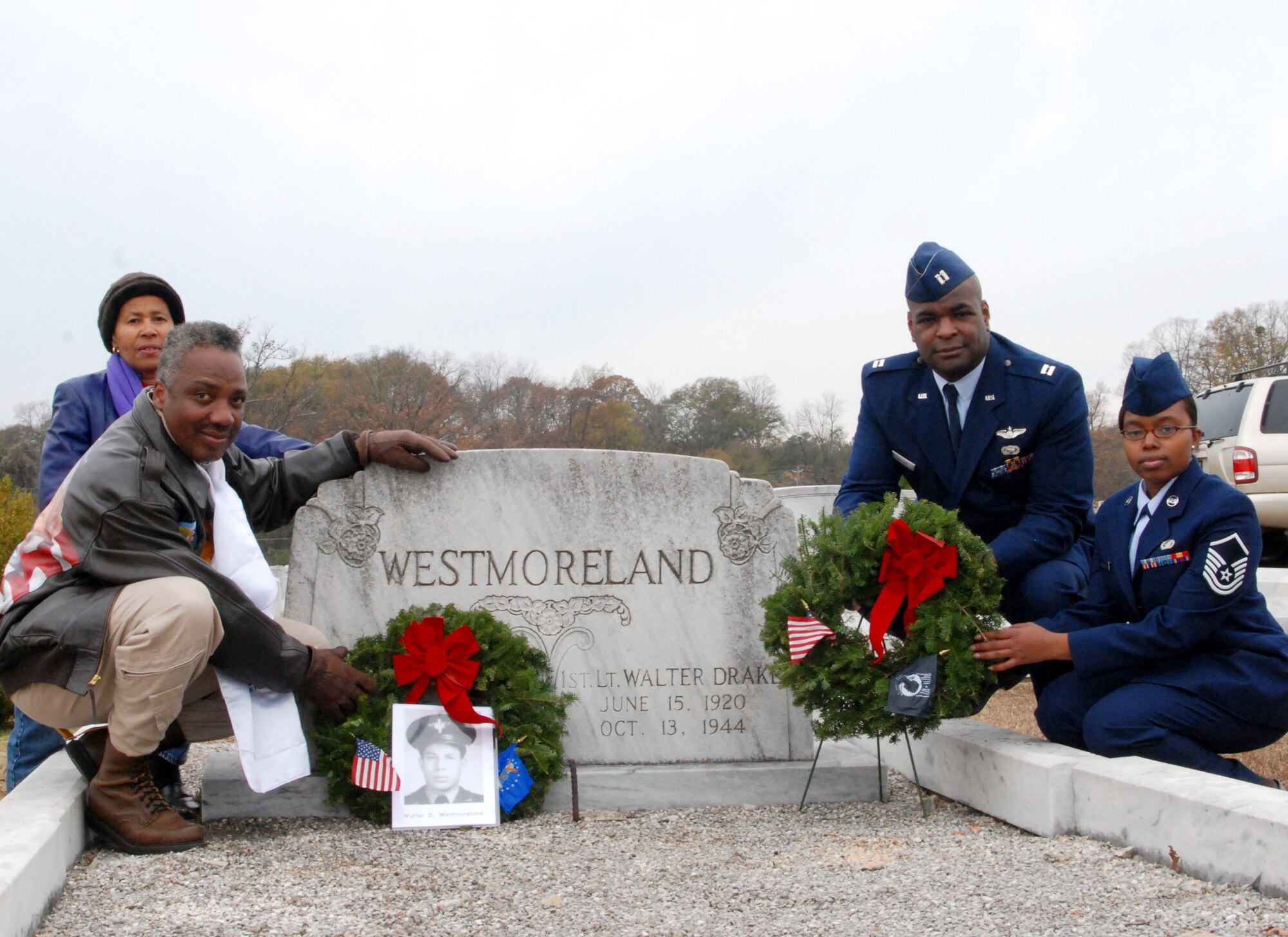 Master Sgt. Michael Varnado, 94th Operations Support Squadron, dressed in a Tuskegee Airman pilot uniform, Ms. Zellie Orr, Tuskegee Airman historian,  Capt.  Darrell Bogan, 94th Equal Opportunity officer, and Master Sgt. Tracy Bridges, 94th OSS intelligence applications NCO, present ceremonial wreaths at the gravesite of 1st Lt. Walter D. Westmoreland—a Tuskegee Airman pilot who was killed in combat during World War II.  All are members of the Atlanta Chapter Tuskegee Airman,  Inc.    The photo of Lieutenant Westmoreland and Tuskegee Airman historical information was provided by Ms. Orr. (U.S. Air Force photo/Master Sgt. Stan Coleman)