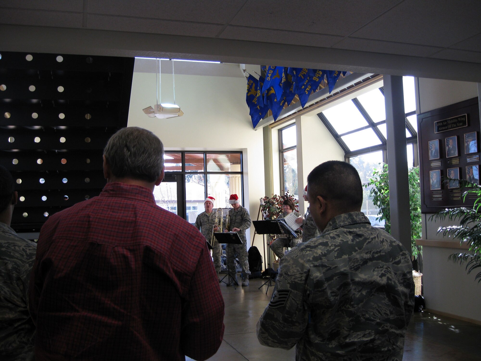 TRAVIS AIR FORCE BASE, Calif. Part of The Band of the Golden West will be came to the 349th Air Mobility Wing Headquarters building on Thursday Dec. 16 to play some Caroling songs. 

They played holiday songs for the folks gathered at the building's front entry to share in this rich holiday tradition. (U.S. Air Force photo/Patti Schwab-Holloway)