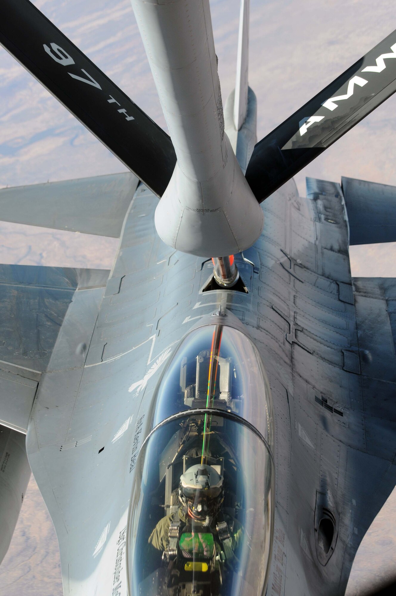 LUKE AIR FORCE BASE, Ariz. -- A 310th Fighter Squadron F-16 Fighting
Falcon is refueled by Staff Sgt. Eric Leclerc, 54th Air Refueling
Squadron boom operator, Dec. 15 via  KC-135 Stratotanker. Sergeant
Leclerc was part of the three-man KC-135 aircrew hailing from Altus Air
Force Base, Okla. that provided refueling support during exercise Cactus
Starfighter. (U.S. Air Force photo by Airman 1st Class Kenneth W. Norman)