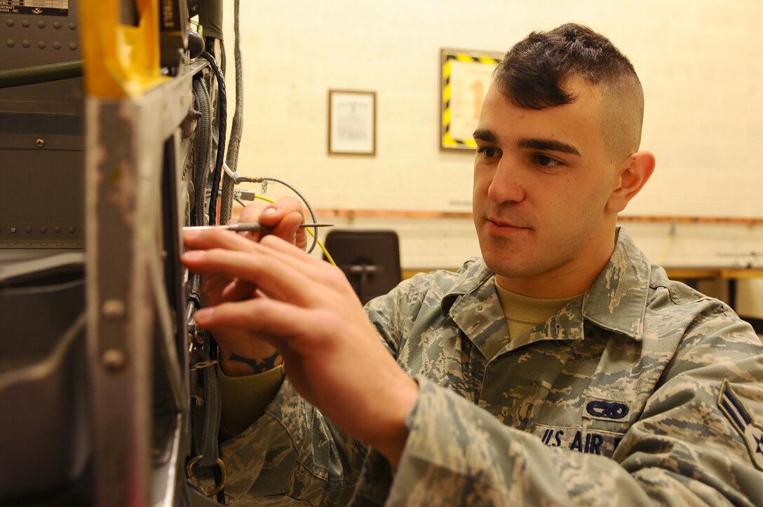 ELLSWORTH AFB, S.D. – Airman 1st Class Kirby Coker, 28th Aircraft Maintenance Squadron aircrew egress systems journeyman, conducts routine maintenance on a B-1B Lancer’s ejection seat, Dec. 15. Seats such as these are inspected every 60 months, or whenever taken out of the aircraft. (U.S. Air Force photo/Senior Airman Kasey Close)