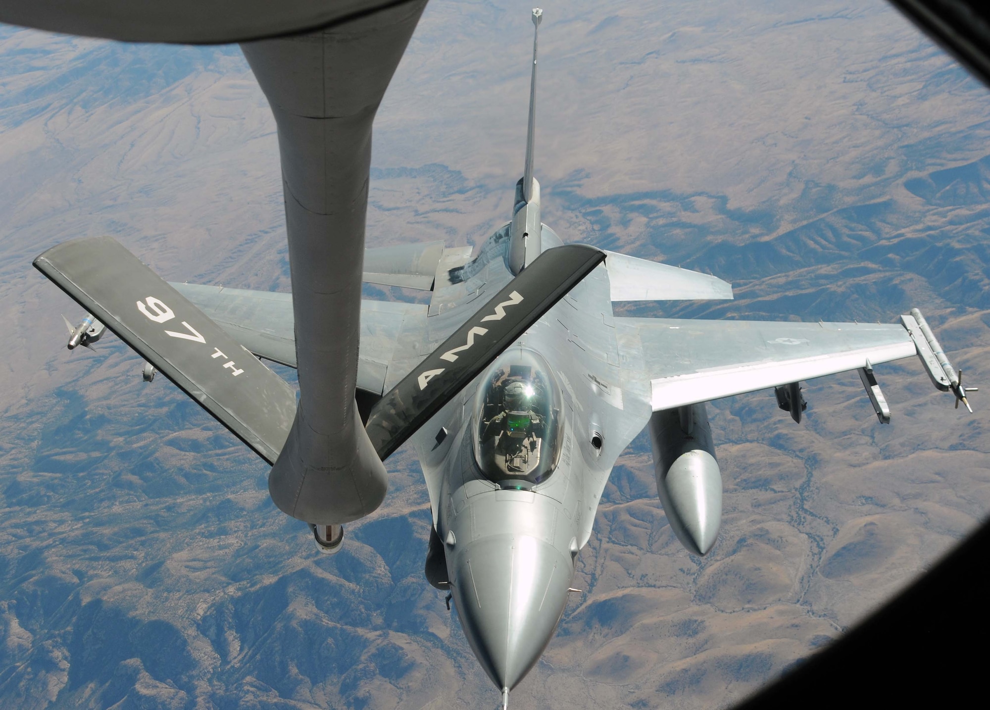 LUKE AIR FORCE BASE, Ariz. -- An F-16 Fighting Falcon from the 310th Fighter Squadron moves into position behind a KC-135 Stratotanker from the
54th Air Refueling Squadron at Altus Air Force Base, Okla. This F-16 was
one of the 12 refueled over Luke AFB during exercise Cactus Starfighter
Dec. 15. Altus' KC-135 was the only aircraft serving as refueling
support during the exercise. (U.S. Air Force photo by Airman 1st Class Kenneth W. Norman