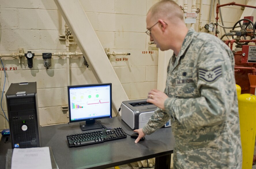 Staff Sgt. Justin Garcia, 2nd Maintenance Squadron supply technician, reviews computer software that tracks parts in a bench stock vending machine in the phase hangar on Barksdale Air Force Base, La., Dec. 15. The software tracks who logs into the machine, what parts they take, and the exact number of each part remaining in stock. (U.S. Air Force photo/Senior Airman Chad Warren) (RELEASED)