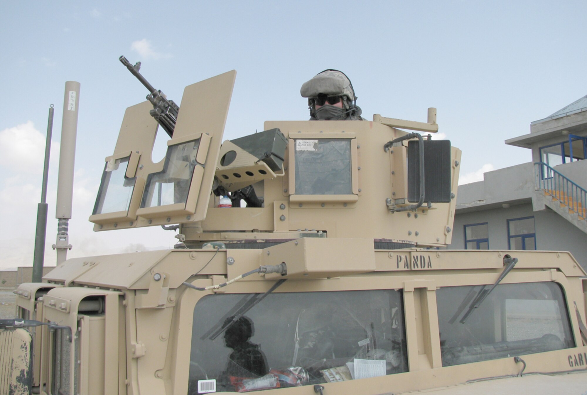Staff Sgt Alexander Yessayan sits in the gunner's seat during a site survey while deployed to Afghanistan in 2009. Sergeant Yessayan was recognized in the Air Force's "Portraits in Courage" series Dec. 10, 2010, for his actions while his convoy was under attack in November 2009. The series tells the stories of Airmen recognized for heroism, valor and sacrifice and was developed to highlight the honor, valor, devotion and selfless sacrifice of America's Airmen. Sergeant Yessayan is assigned to the 53rd Combat Communications Squadron. (U.S. Air Force photo/ Senior Airman Mark Moreno)
