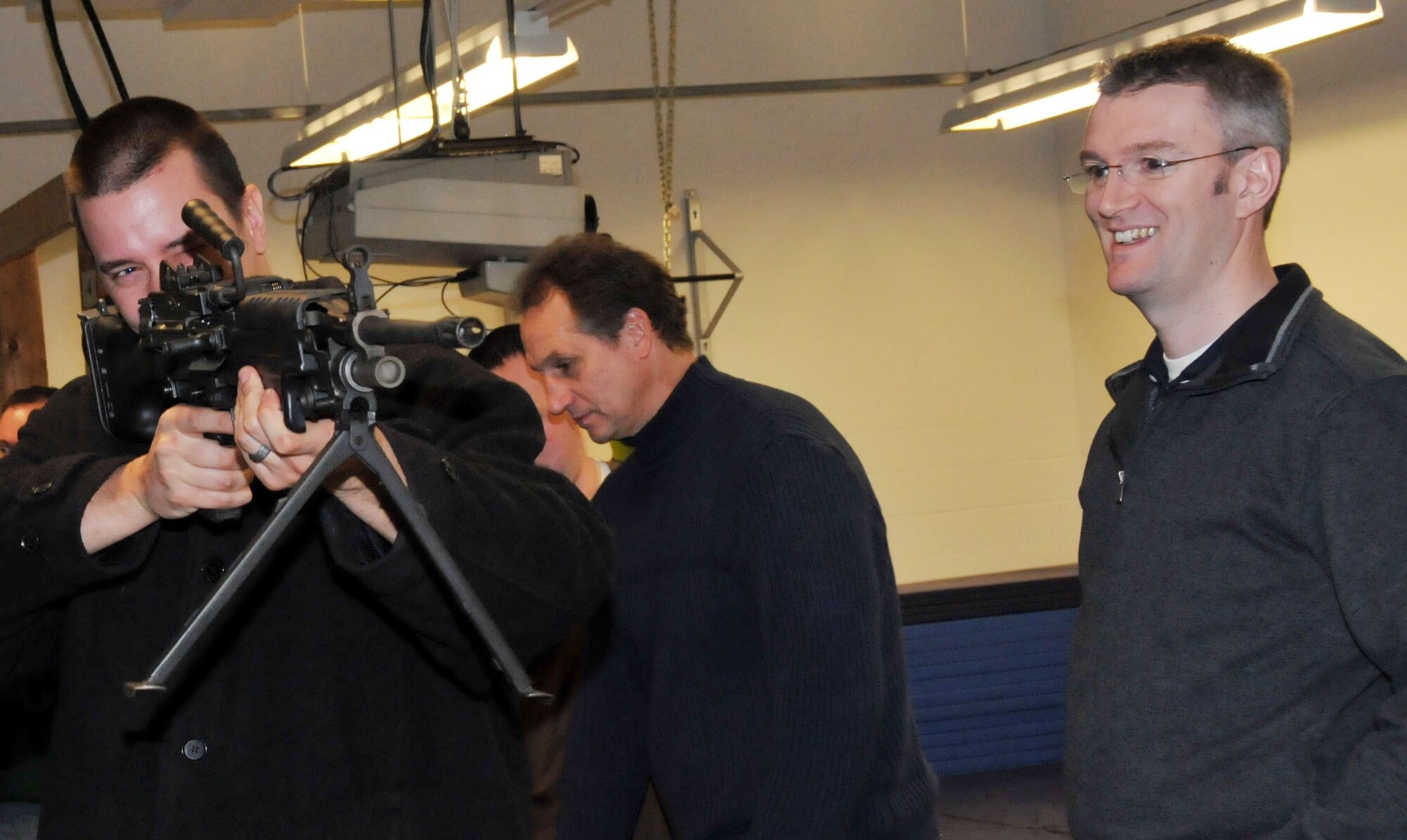 Members of the Minnesota Wild, Defending the Blue Line and National Hockey League Players Association take tour the 934th Security Forces Squadron Dec. 16. (Air Force Photo/Paul Zadach)